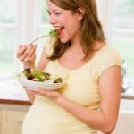Pregnant-woman-eating-food-for-two
