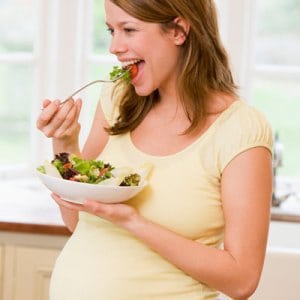 Pregnant-woman-eating-food-for-two